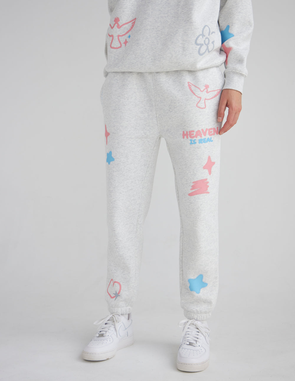 Heaven Is Real heather grey sweatpants with pink and blue graphics and elastic ankle cuffs