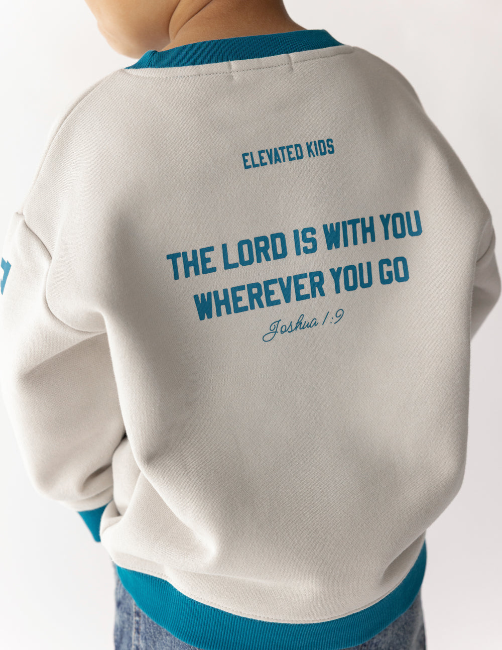 Back of the Heaven’s Favorite kids sweatshirt showing the message The Lord is with you wherever you go