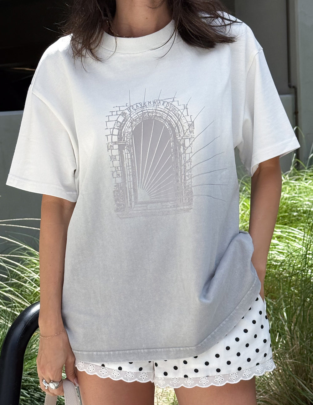 Front view of the Heavenward Heavyweight Tee in Stone Grey Ombre showing an architectural doorway graphic