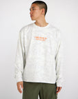 Front view of the White Camo heavyweight long sleeve tee with orange I Believe in Miracles lettering