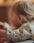Child sitting on a couch with a blurred background