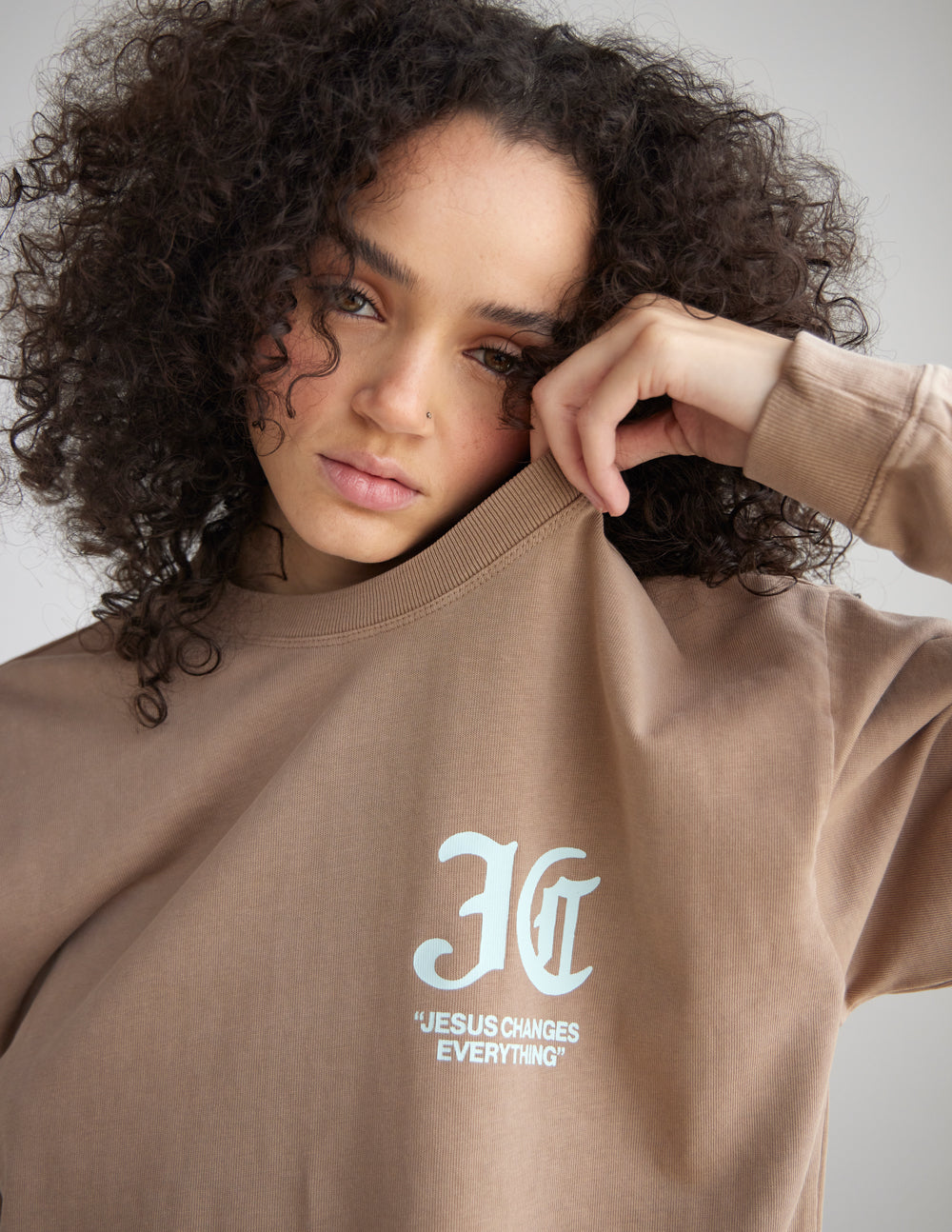 Close-up of the white chest graphic on the dune heavyweight long sleeve tee