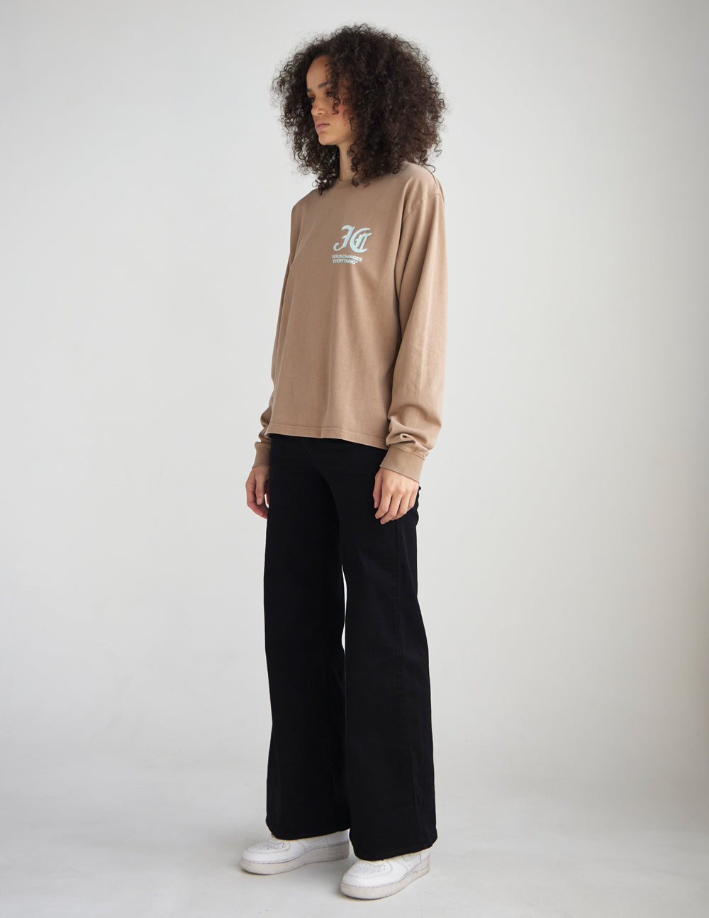 Side view of the Jesus Changes Everything long sleeve tee showing its relaxed fit