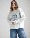 Front view of the Kingdom Culture heavyweight long sleeve tee showing the blue chest graphic.