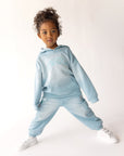 Child wearing the oversized Air Blue Kingdom Kids Hoodie with coordinating pants