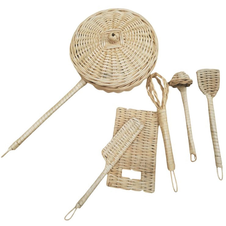Set of wicker kitchen utensils including a whisk, ladle, and rolling pin on a white background