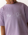 Close-up of Me + God lettering on the Quiet Violet cotton kids T-shirt