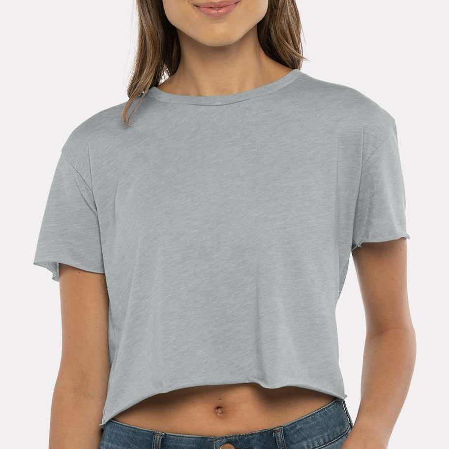 Woman wearing a grey Next Level Apparel Women’s Festival Crop Tee with a relaxed, lightweight fit — perfect for custom printing, events, and boutique designs by Lumiere Vive.