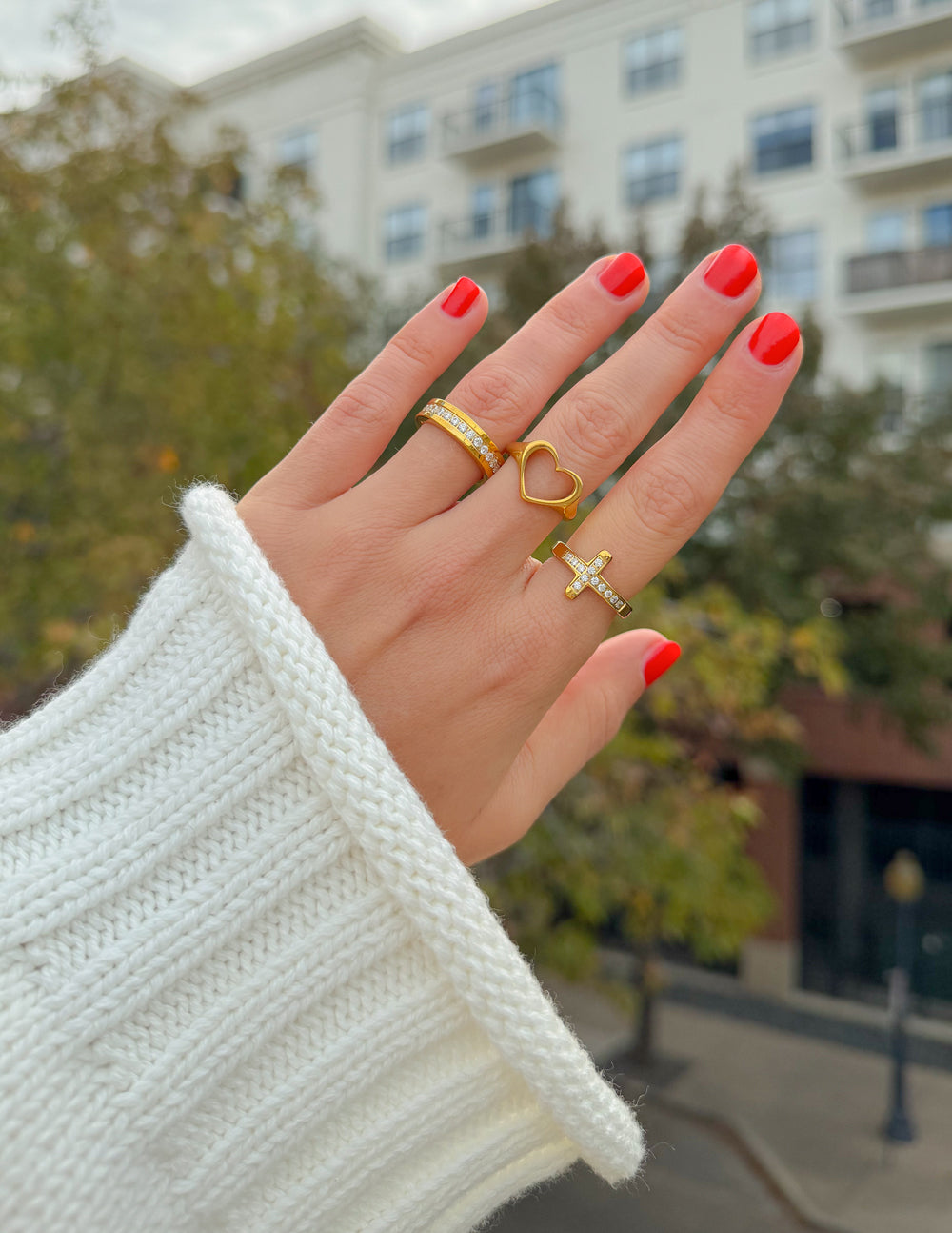 Gold-tone Open Heart Ring styled with a light knit sweater