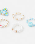 Set of five colorful bracelets on a white background