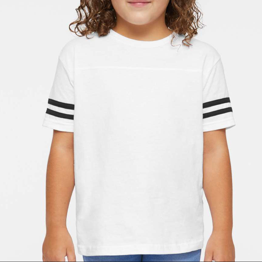 Young girl wearing a white t-shirt with black stripes on sleeves against a plain background