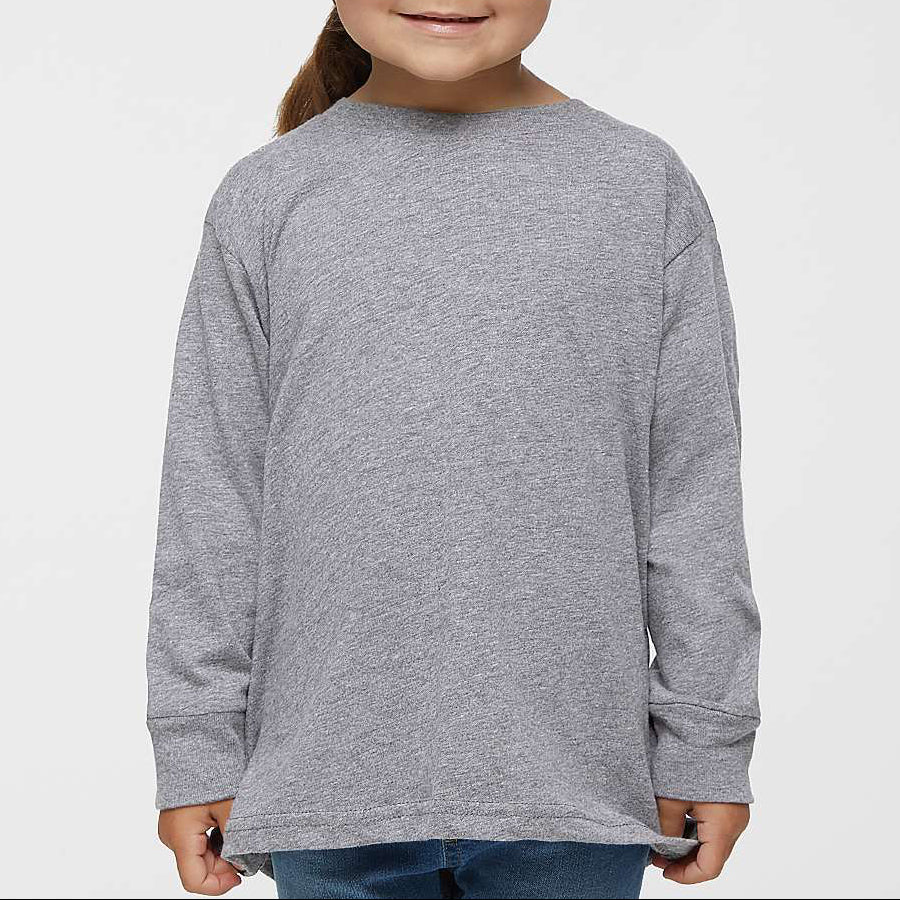 Young girl wearing a gray long-sleeve shirt on a light gray background