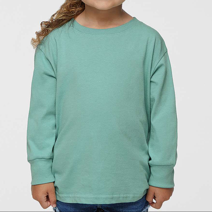 Young girl wearing a light green long-sleeve shirt against a plain background