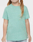 Young girl wearing a light green t-shirt on a white background