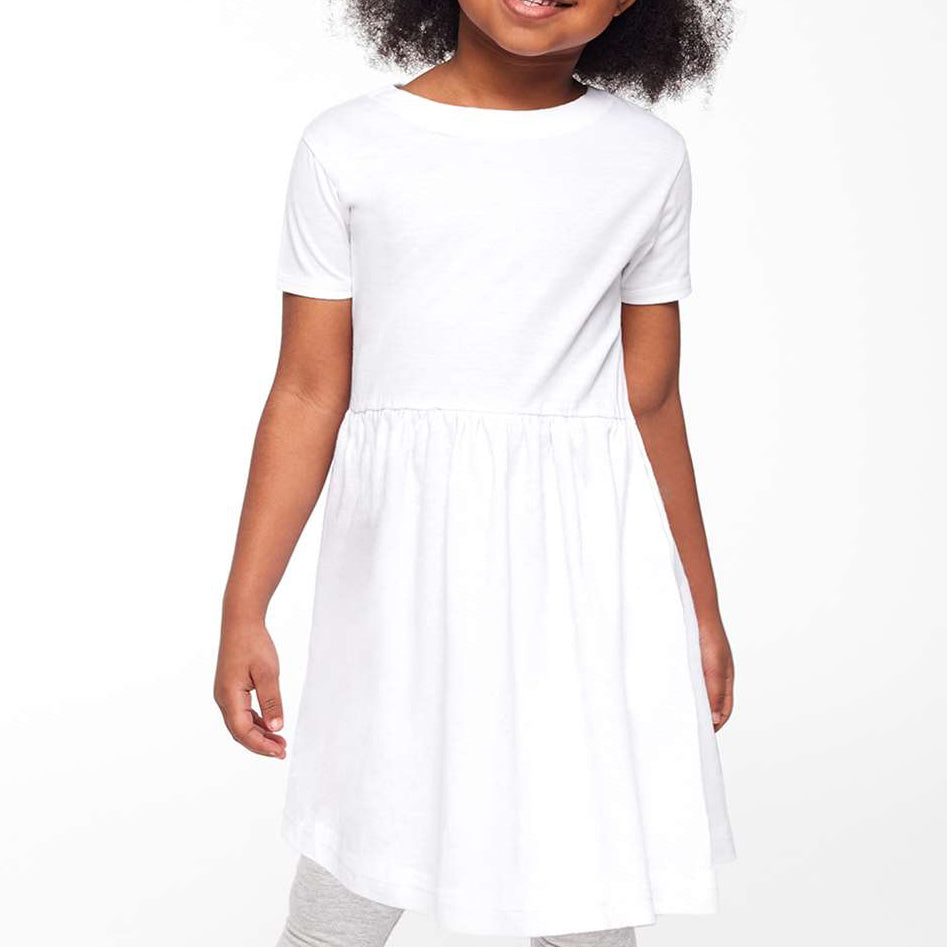 Young girl wearing a white dress on a white background