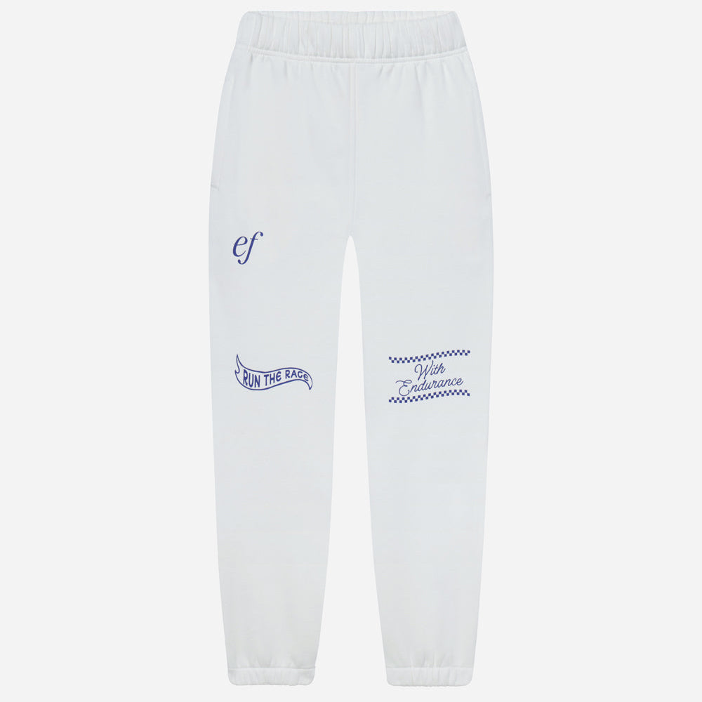 White sweatpants with blue embroidery on a white background