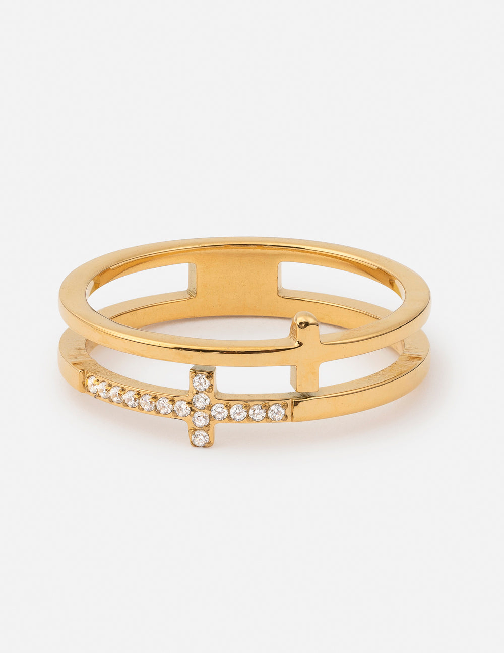 Gold-tone stacked cross ring with layered bands, a polished cross, and a clear gem-accented cross on a white background