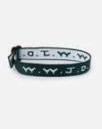 Forest Green WWJD adjustable woven bracelet with contrasting lettering