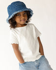 Side view of child wearing the WWJD denim bucket hat
