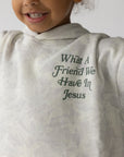 Close-up of green What a Friend We Have in Jesus chest lettering on the white camo kids hoodie