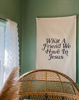 Decorative banner with text on a green wall next to a window with white curtains.