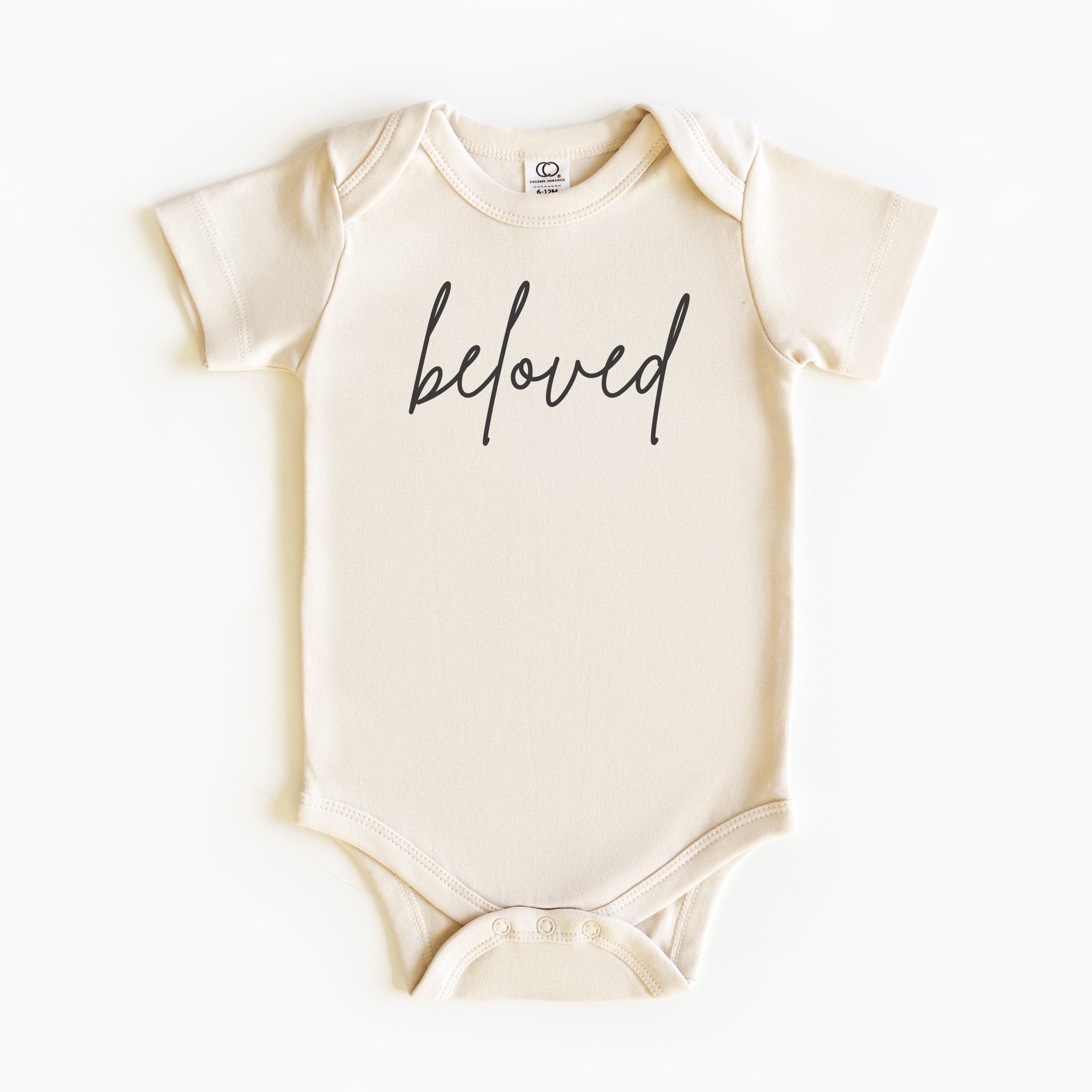 Baby wearing “Beloved” affirmation bodysuit – Christian script design organic cotton outfit by Lumiere Vive