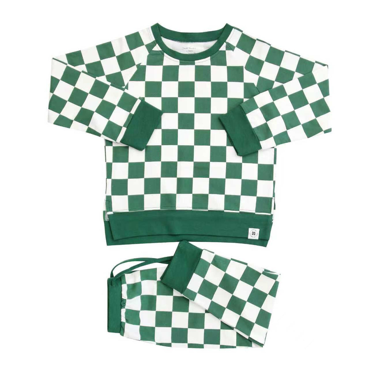Green and cream checkerboard long sleeve crewneck top and matching jogger pants shown on a white background