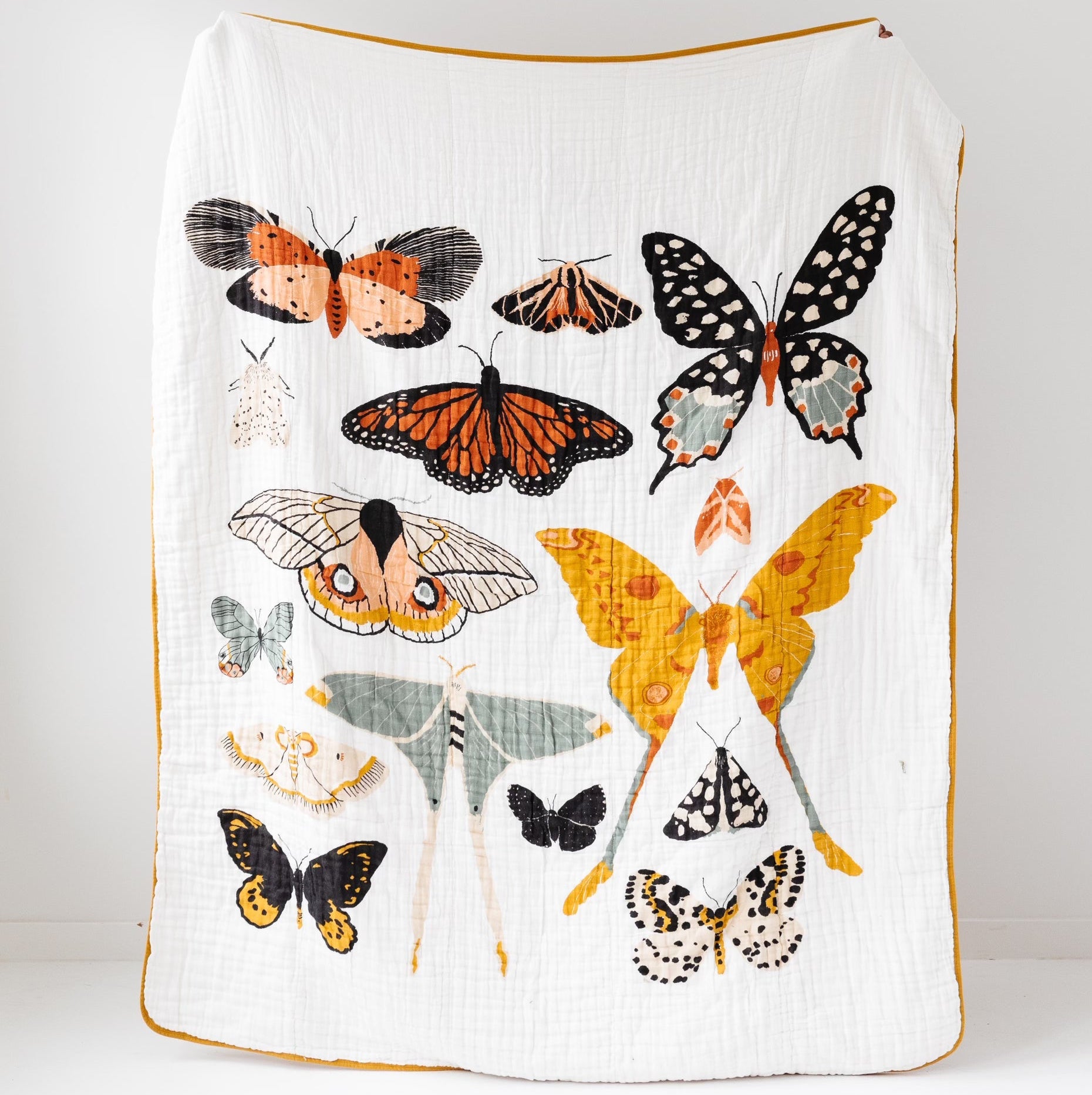 Blanket with butterfly designs on a white background