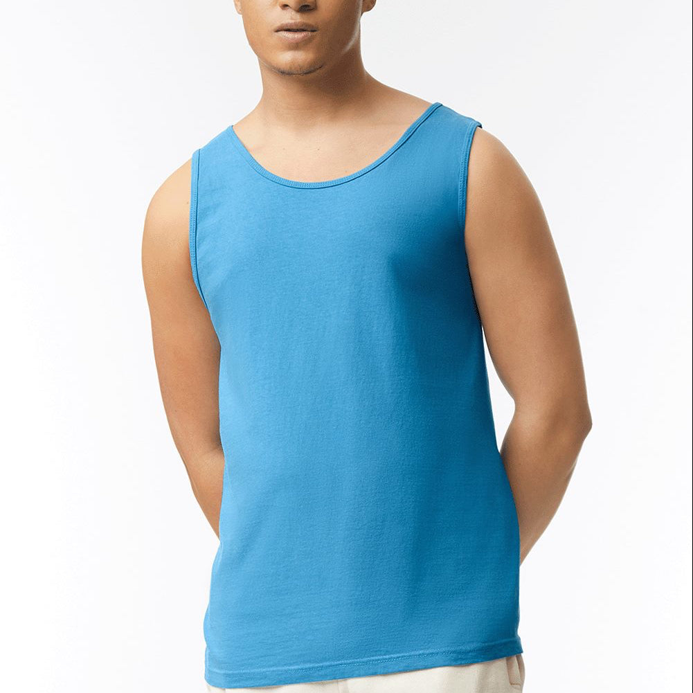 Man wearing a blue tank top against a white background