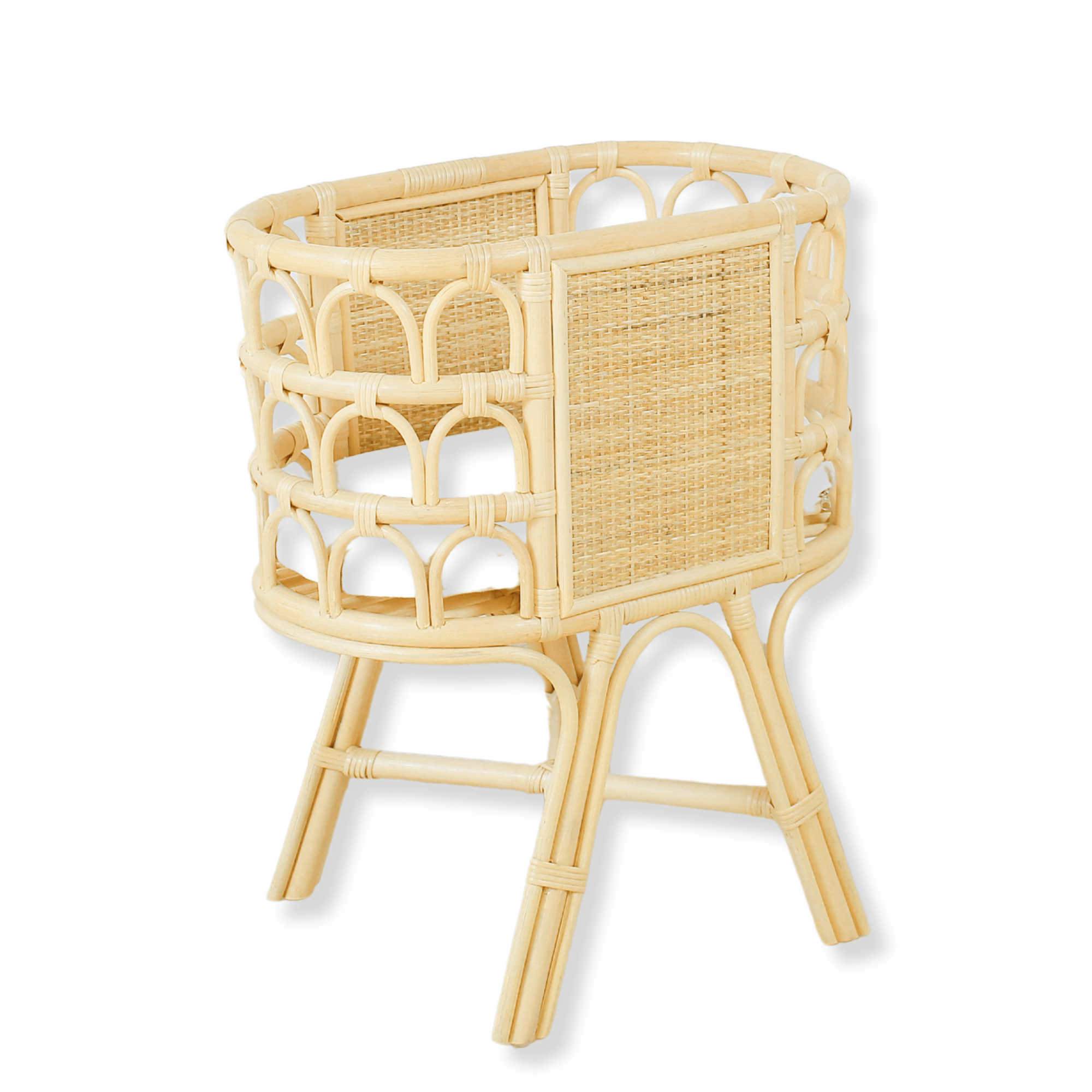 Wicker baby crib on a white background