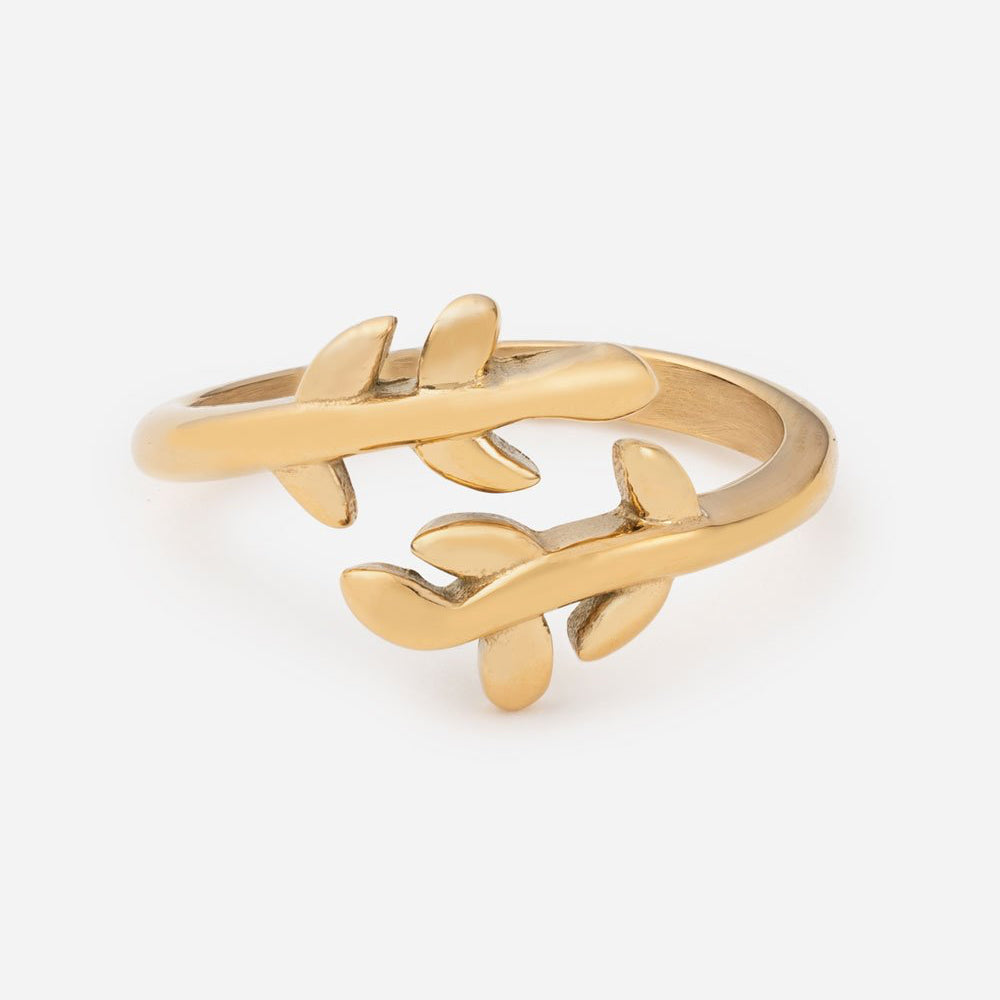 Gold branch-shaped ring on a white background