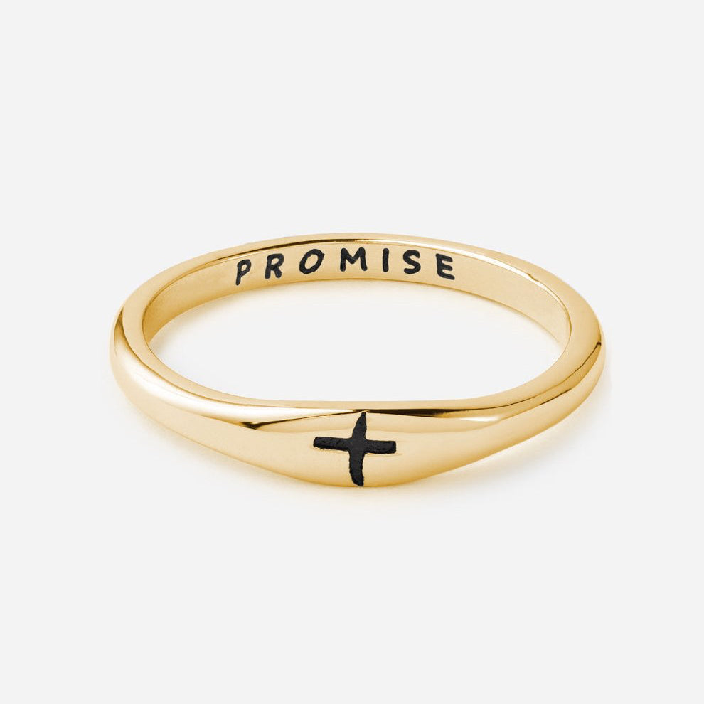 Gold ring with 'Promise' and a cross on a white background