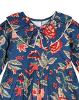 Close-up of the Midnight Bloom dress showing its floral print, Peter Pan collar, and neckline tie.