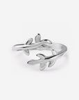 Olive Branch silver-tone ring with delicate leaves and an open-ended wrap design on a white background