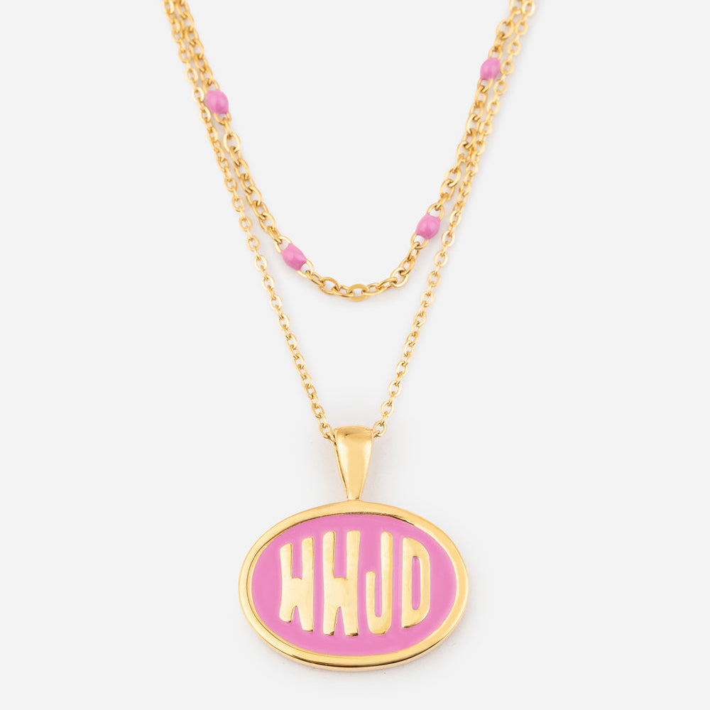 Gold necklace with a pink pendant on a white background