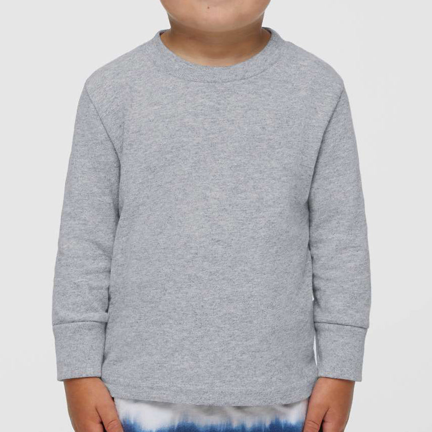 Toddler boy wearing a heather Rabbit Skins 3311 cotton jersey long sleeve tee, front view, ideal for custom printing