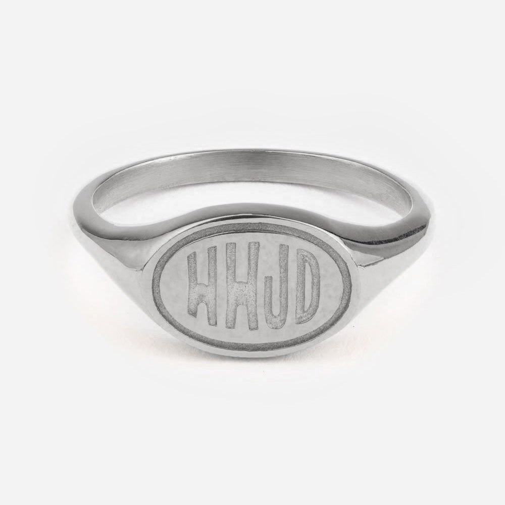 Silver ring with 'HHJD' engraving on a white background