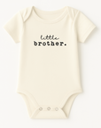 Natural organic cotton short sleeve baby bodysuit with black little brother lettering and bottom snaps